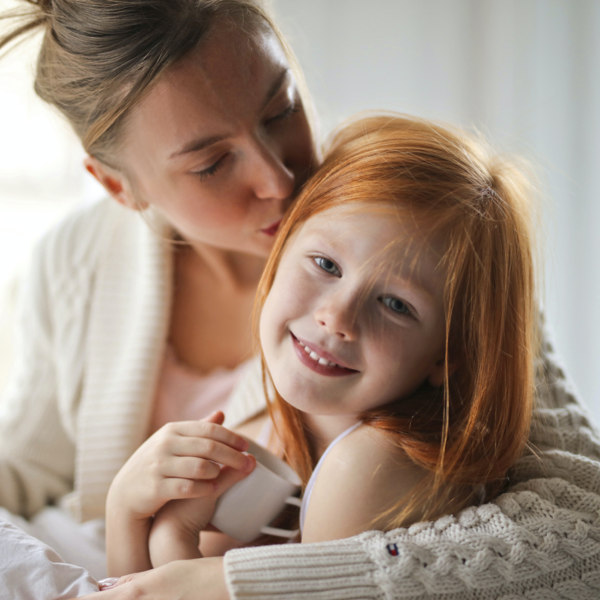 Mother-Kissing-Daughters-Head