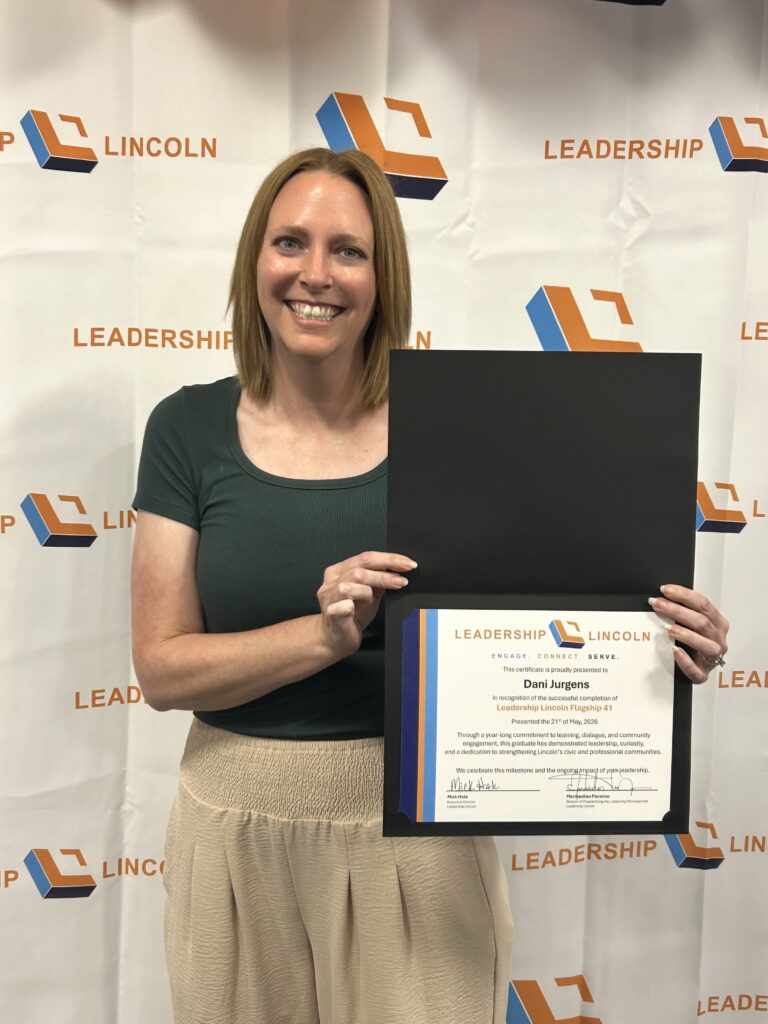 Dani Jurgens holding Leadership Lincoln graduation certificate